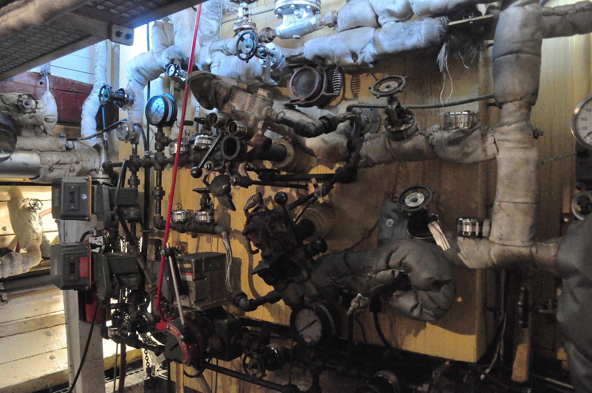 Before: an aged furnace surrounded by tangled, unlabelled pipework